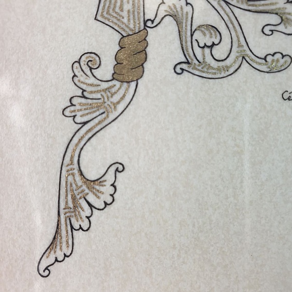 Lettre R enluminée avec motifs végétaux dorés style roman.